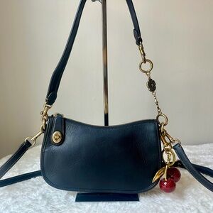 Coach Swinger Bag 20 in black with cherry charm